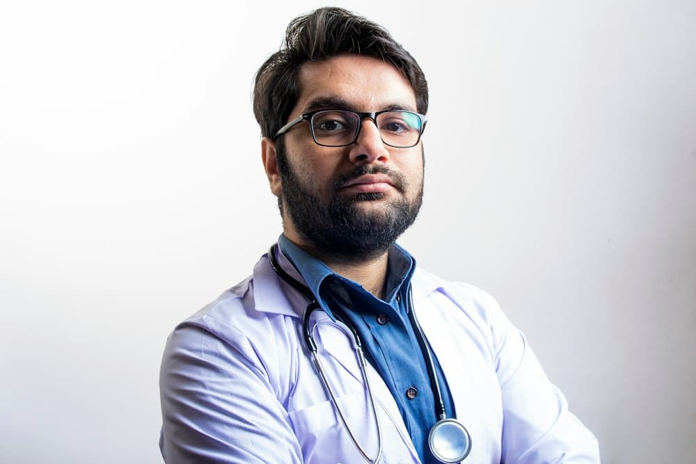 A veterinarian in a white coat with a stethoscope