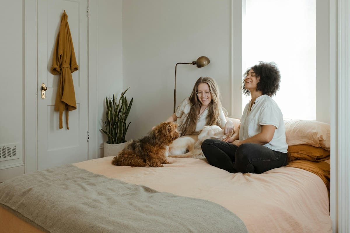 A couple relaxing at home with their cat